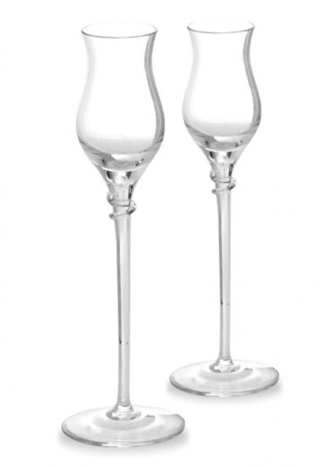 Two clear champagne flutes standing side by side on a white background, ready for a toast.